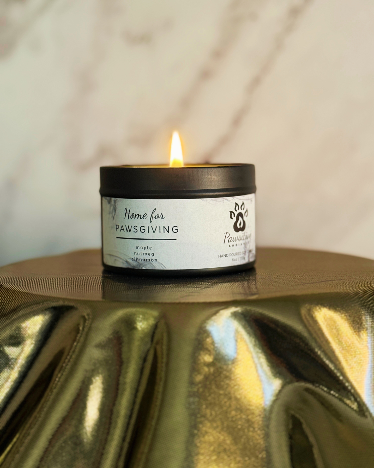 Hand-poured soy candle labeled Wine & Whiskers featuring notes of maple, nutmeg and cinnamon. 6 oz. Manufactured by Pawsitive Ambiance.