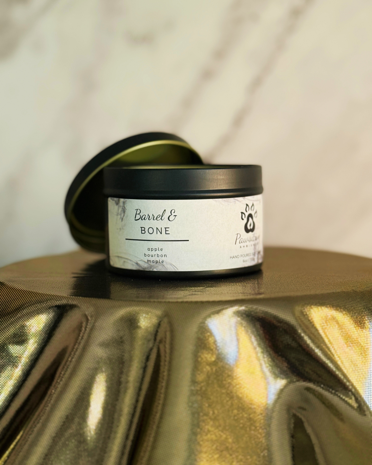 Hand-poured soy candle labeled Wine & Whiskers featuring notes of apple, bourbon and maple.  6 oz. Manufactured by Pawsitive Ambiance.