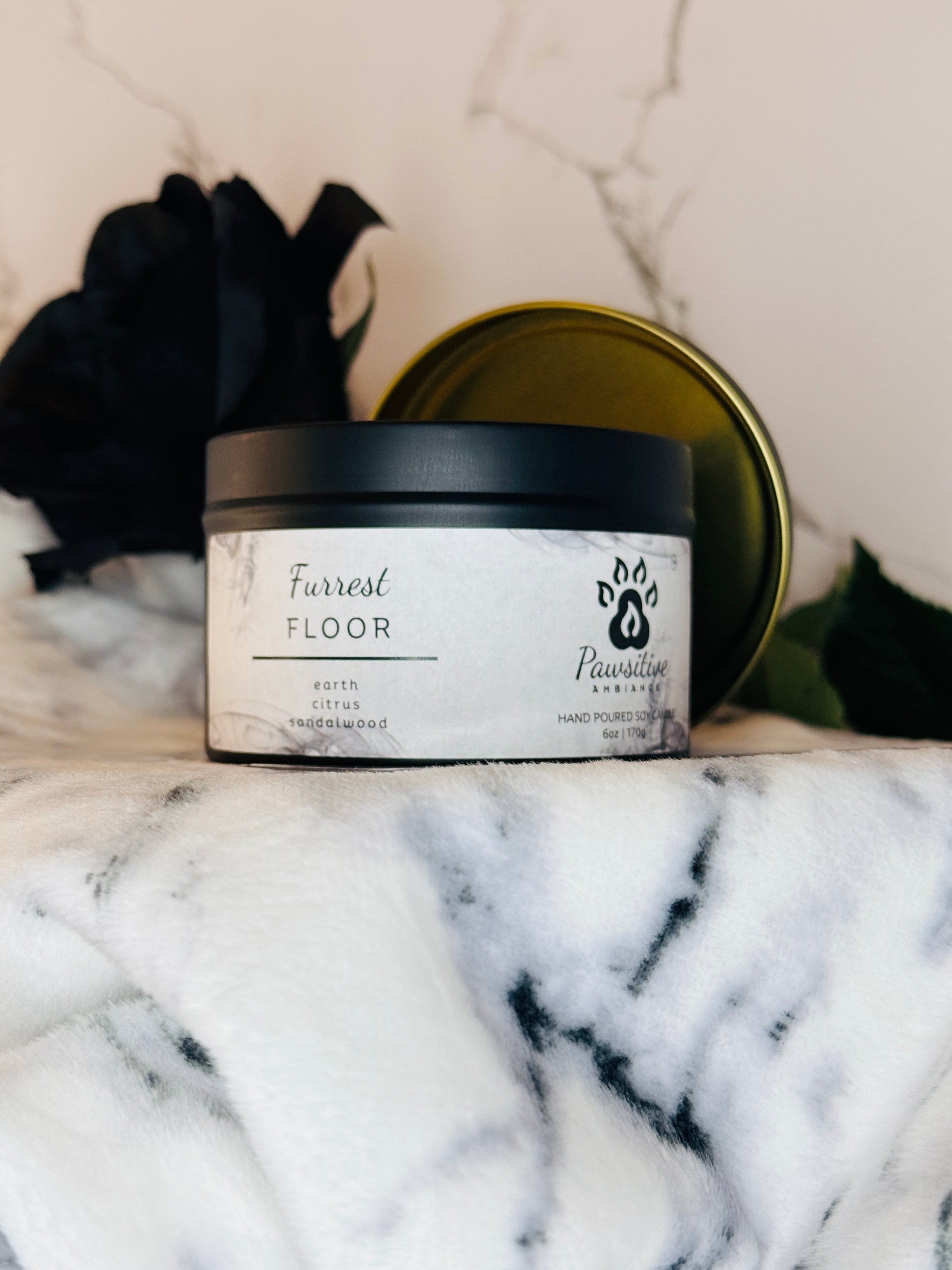 Hand-poured soy candle labeled Wine & Whiskers featuring notes of earth, citrus and sandalwood.  6 oz. Manufactured by Pawsitive Ambiance.