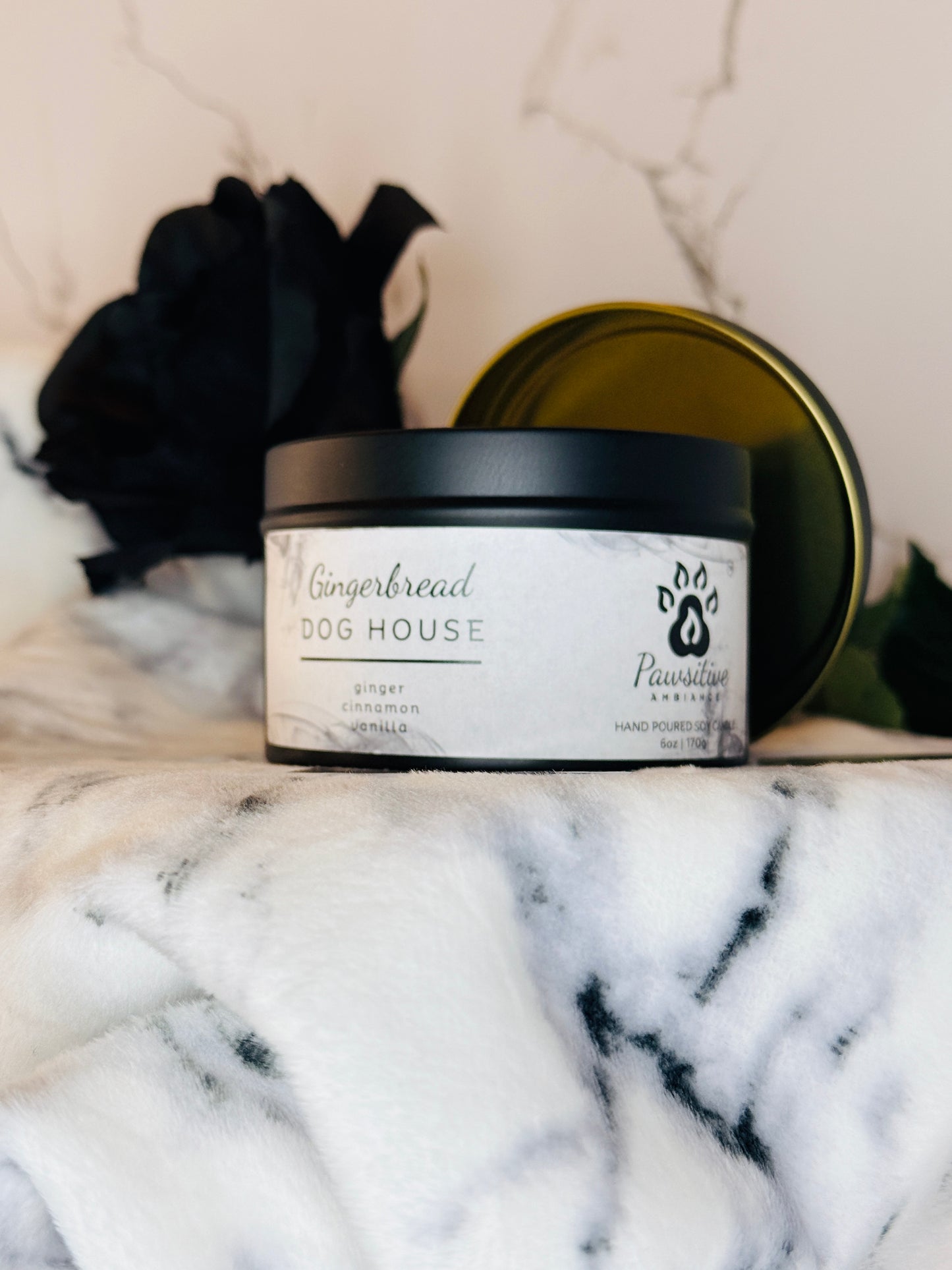 Hand-poured soy candle labeled Gingerbread Dog House featuring notes of ginger, cinnamon and vanilla.  6 oz. Manufactured by Pawsitive Ambiance.