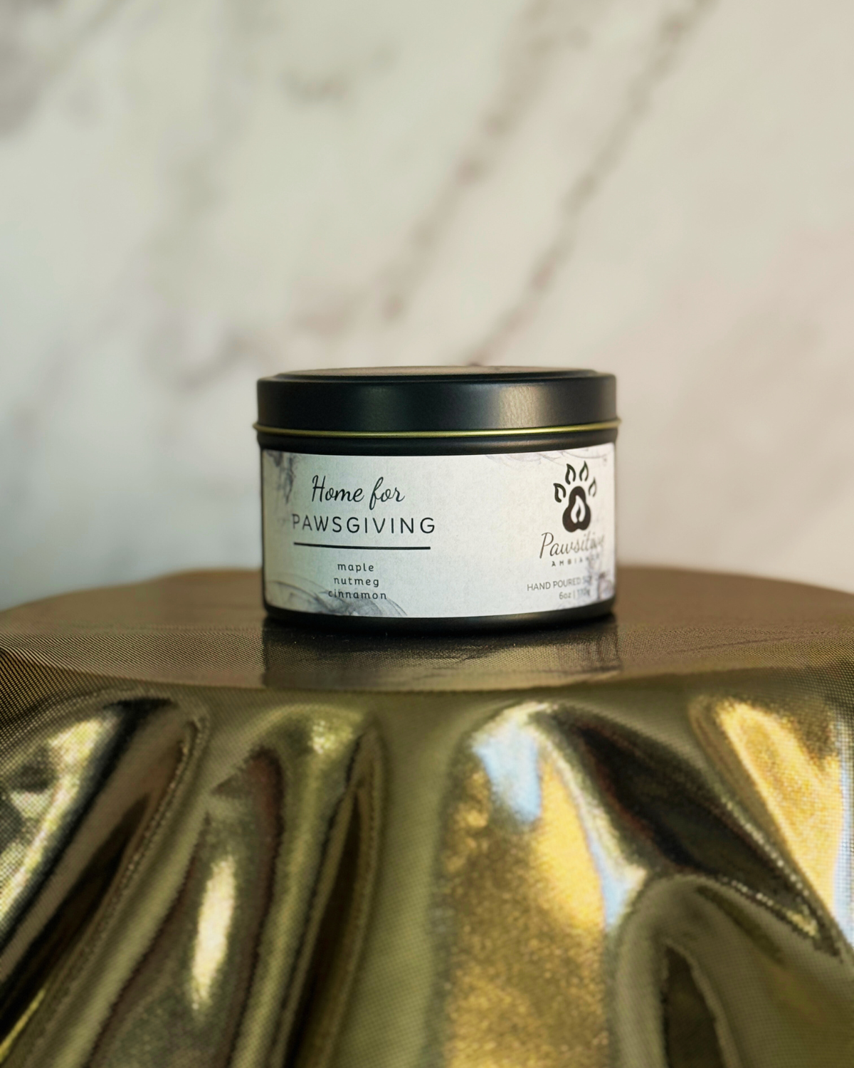 Hand-poured soy candle labeled Wine & Whiskers featuring notes of maple, nutmeg and cinnamon.  6 oz. Manufactured by Pawsitive Ambiance.