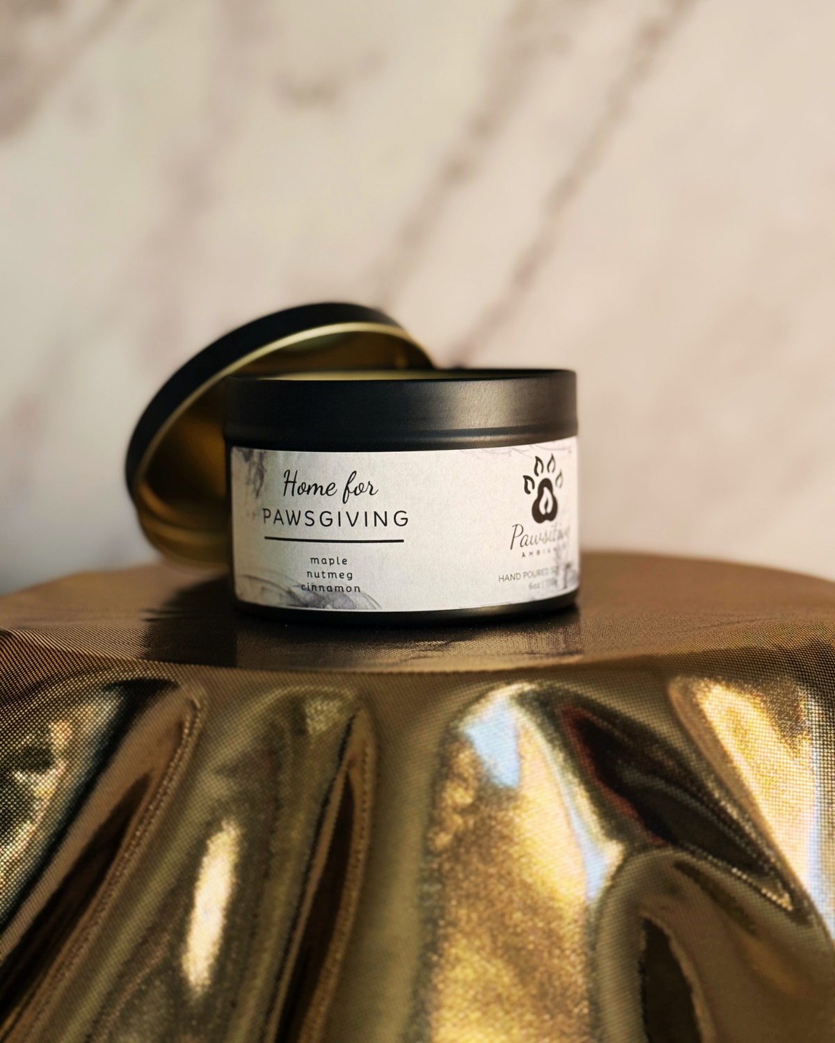 Hand-poured soy candle labeled Wine & Whiskers featuring notes of maple, nutmeg and cinnamon.  6 oz. Manufactured by Pawsitive Ambiance.