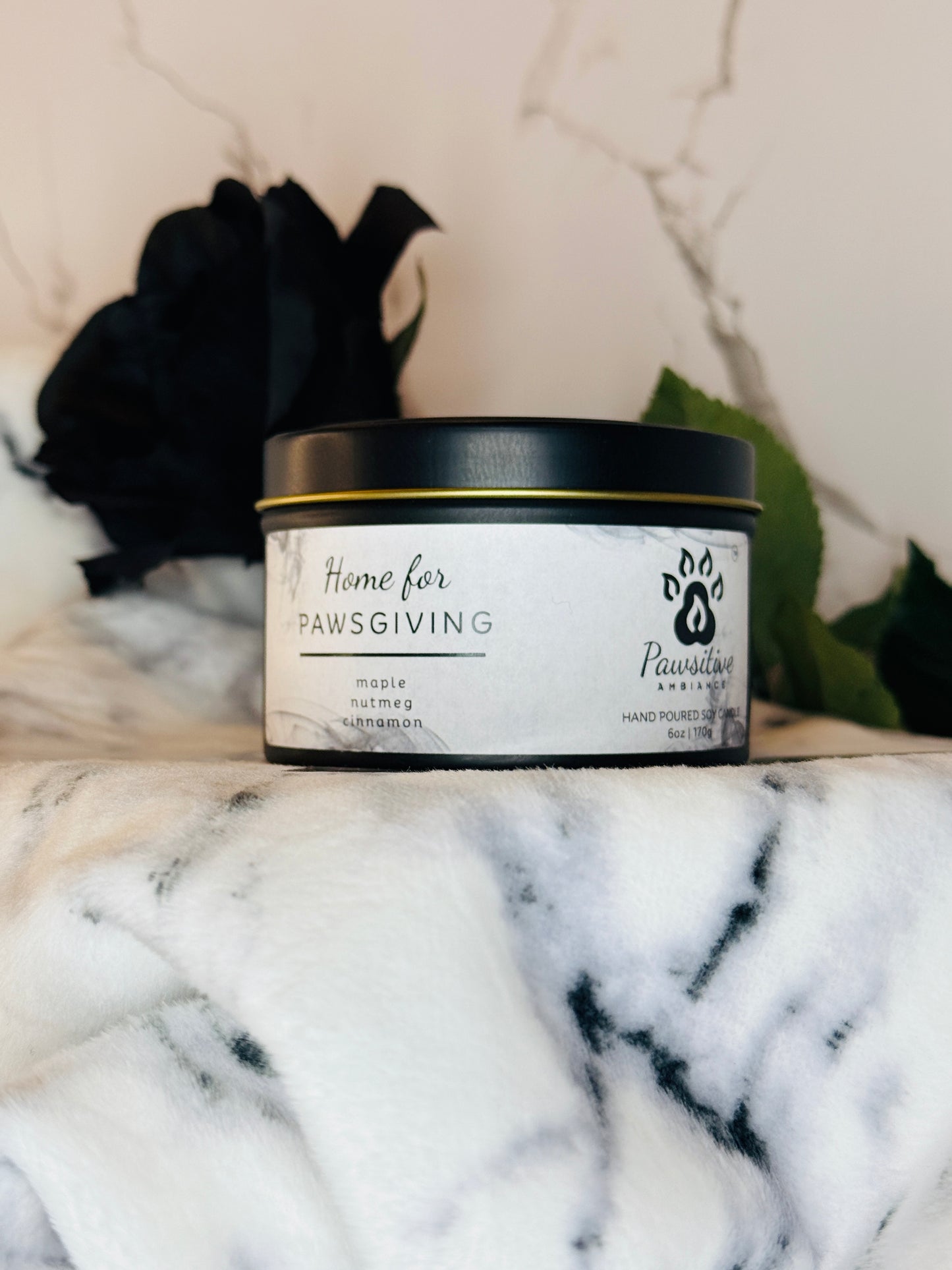 Hand-poured soy candle labeled Home for Pawsgiving featuring notes of maple, nutmeg and cinnamon.  6 oz. Manufactured by Pawsitive Ambiance.