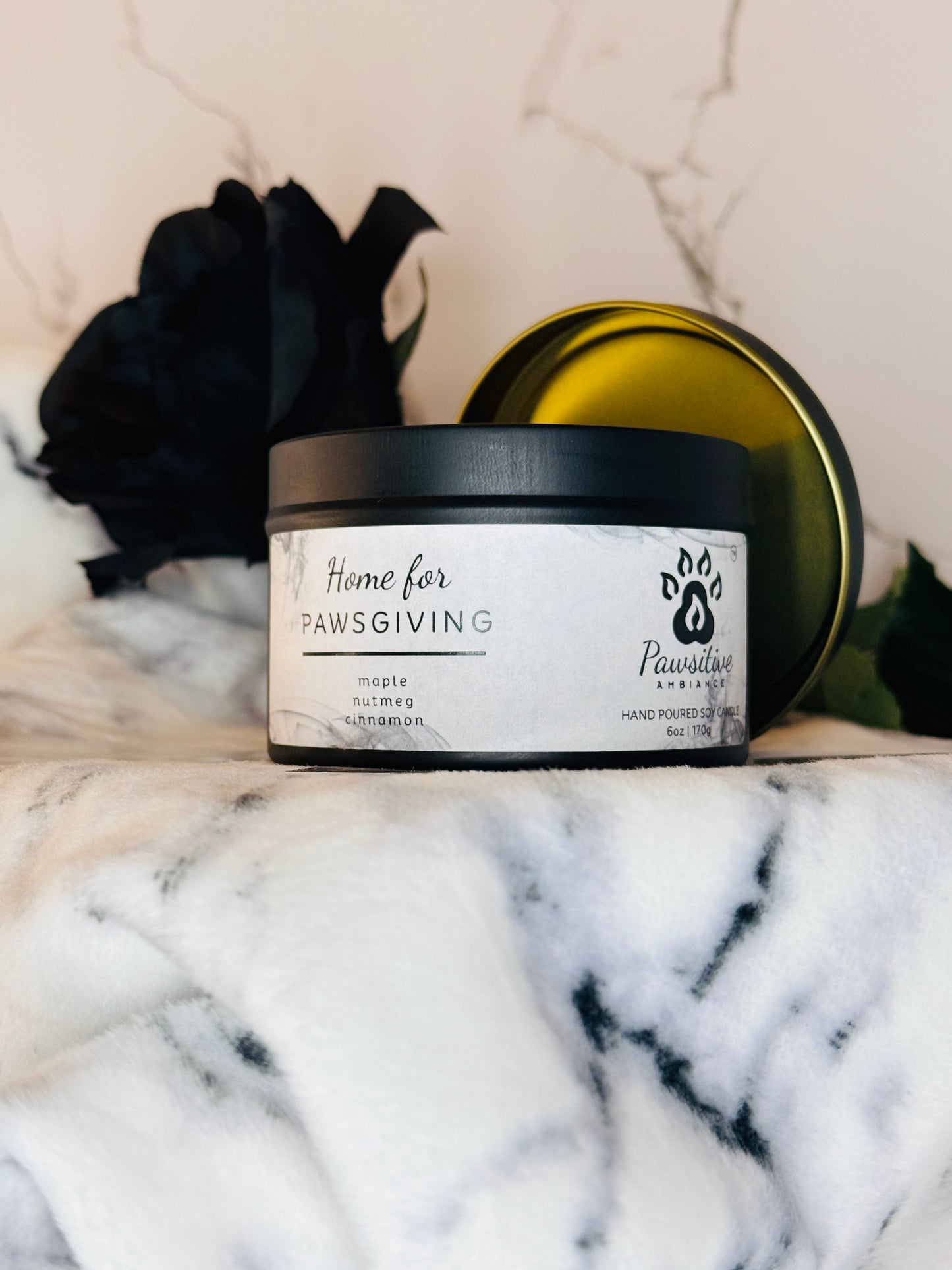 Hand-poured soy candle labeled Home for Pawsgiving featuring notes of maple, nutmeg and cinnamon.  6 oz. Manufactured by Pawsitive Ambiance.