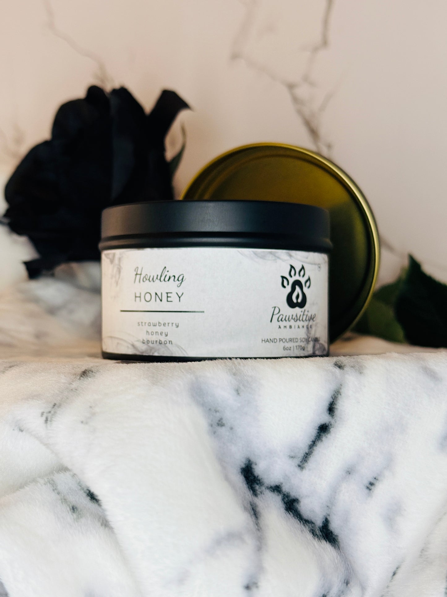 Hand-poured soy candle labeled Wine & Whiskers featuring notes of strawberry, honey and bourbon.  6 oz. Manufactured by Pawsitive Ambiance.