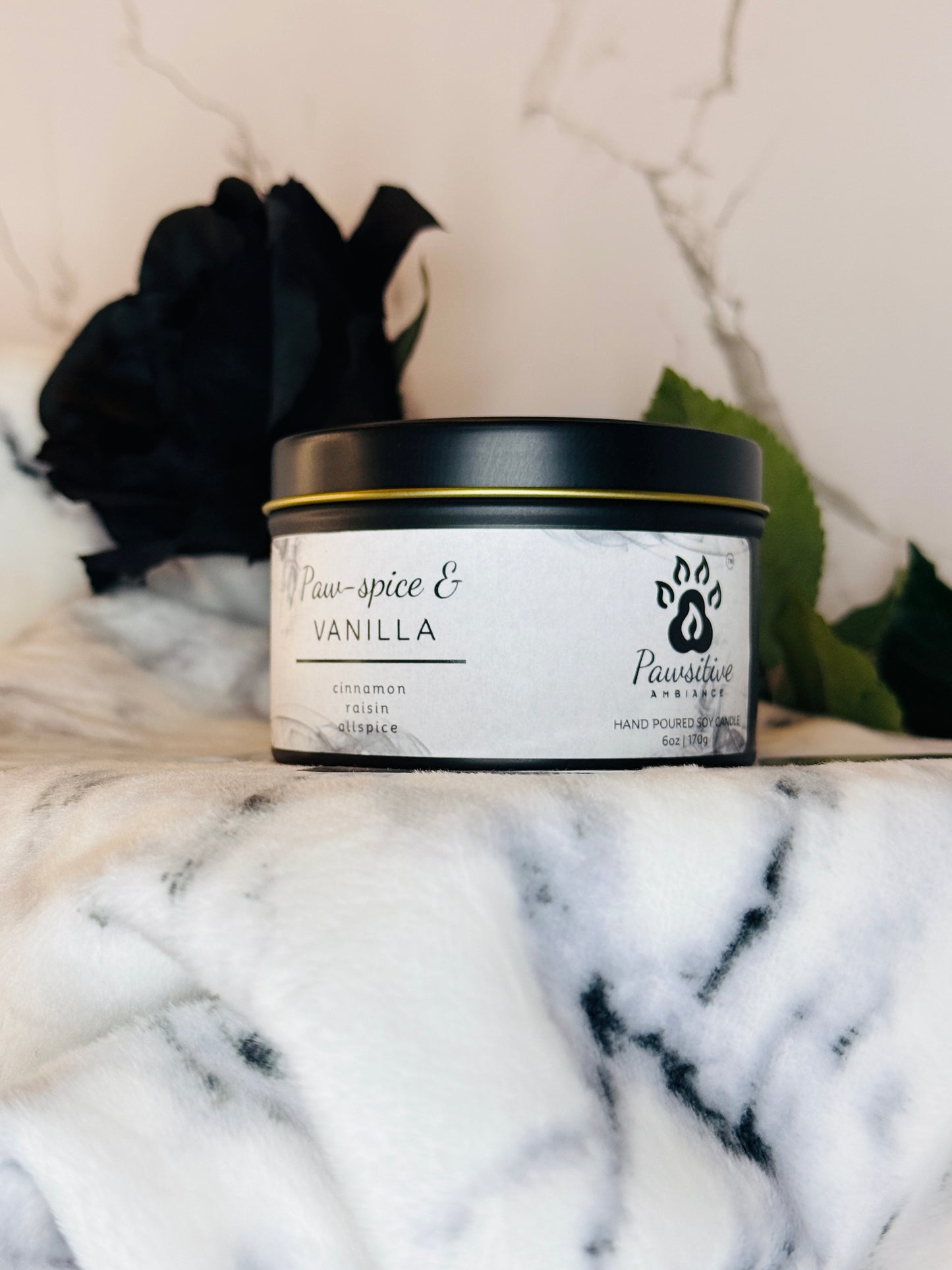 Hand-poured soy candle labeled Paw-Spice & Vanilla featuring notes of cinnamon, raisin and allspice.  6 oz. Manufactured by Pawsitive Ambiance.