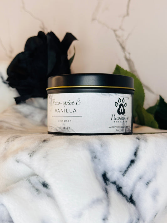 Hand-poured soy candle labeled Paw-Spice & Vanilla featuring notes of cinnamon, raisin and allspice.  6 oz. Manufactured by Pawsitive Ambiance.