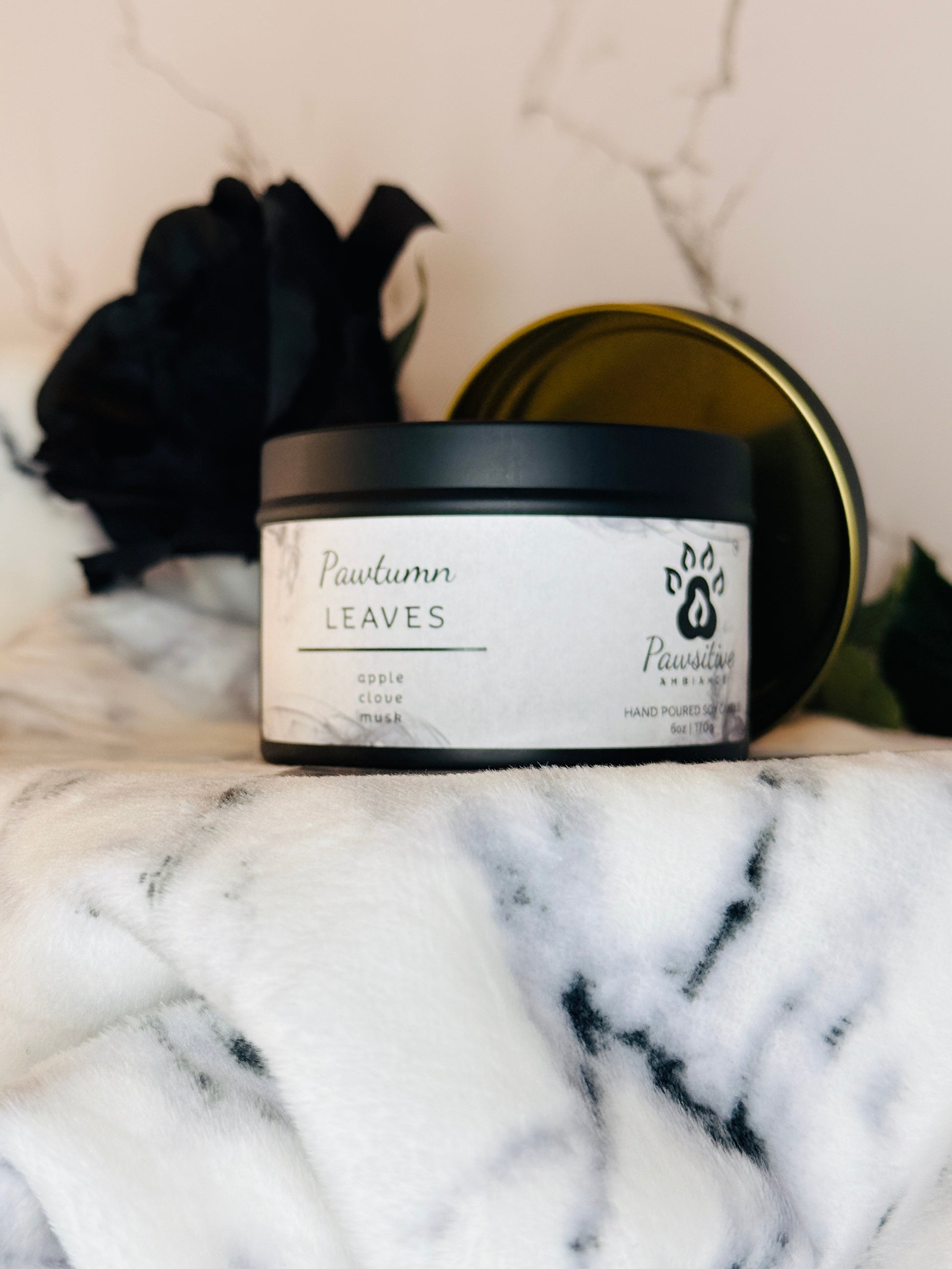 Hand-poured soy candle labeled Pawtumn Leaves featuring notes of apple, clove, musk.  6 oz. Manufactured by Pawsitive Ambiance.