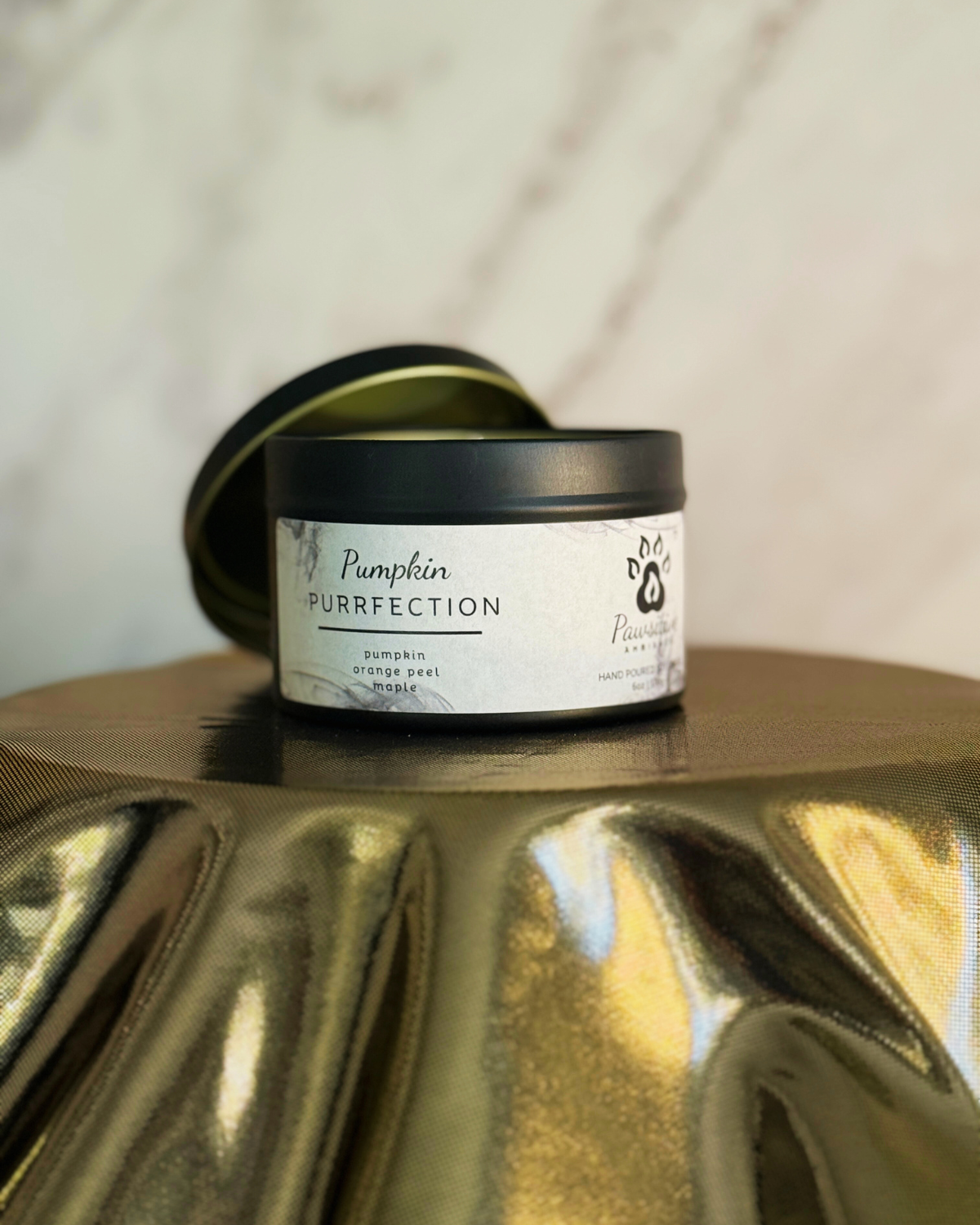 Hand-poured soy candle labeled Wine & Whiskers featuring notes of pumpkin, orange peel and maple.  6 oz. Manufactured by Pawsitive Ambiance.