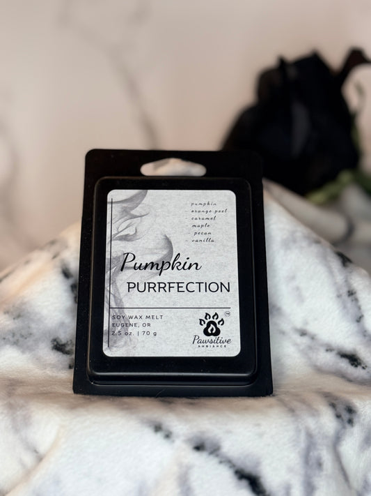 Hand poured soy wax melt labeled Pumpkin Purrfection featuring notes of pumpkin, orange peel, caramel, maple, pecan and vanilla.  Made in Eugene, Oregon. 2.5 oz. Manufactured by Pawsitive Ambiance.
